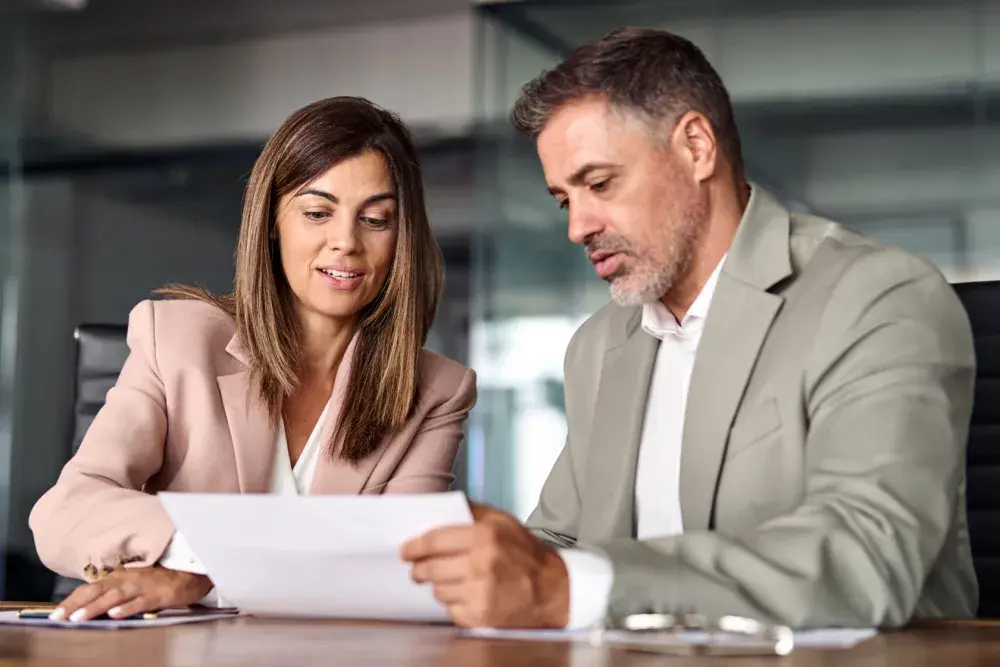 Owners of an LLP look at their BOIR paperwork. LegalZoom can help you with filing your Beneficial Ownership Information Report. 